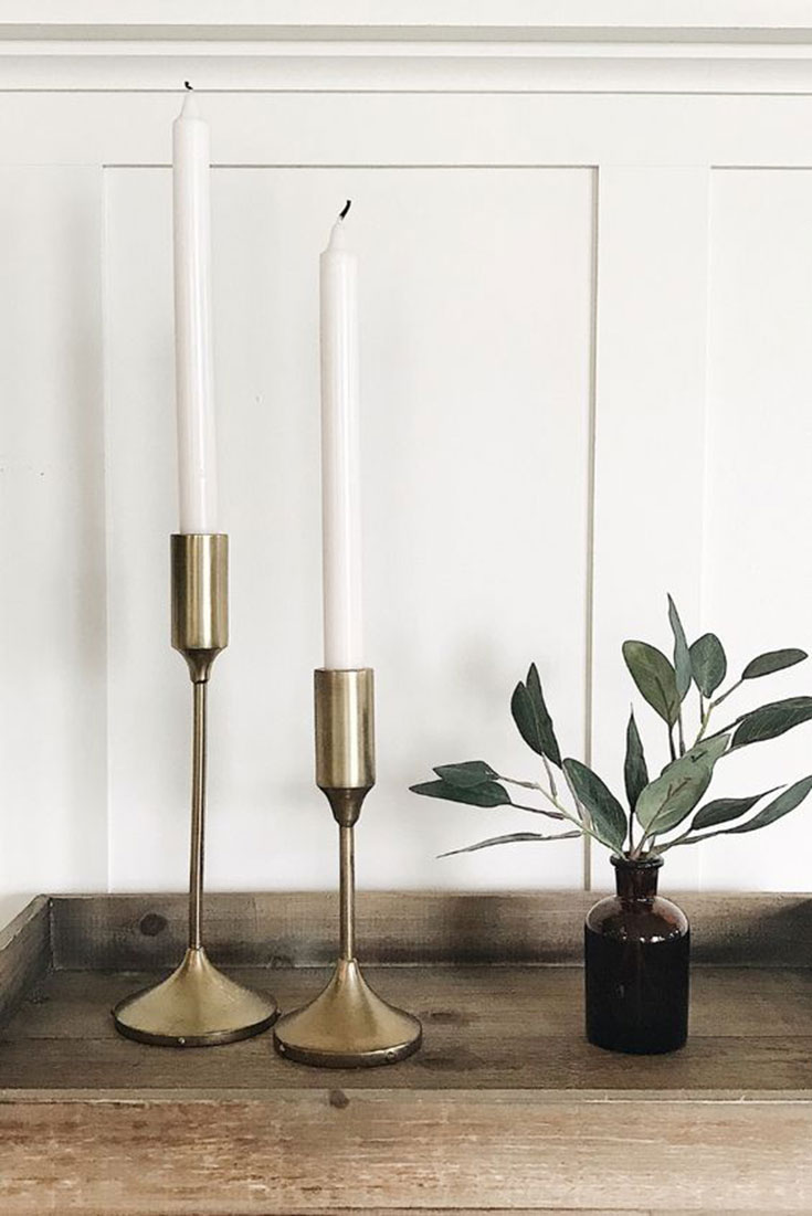 Warm metal candlesticks.