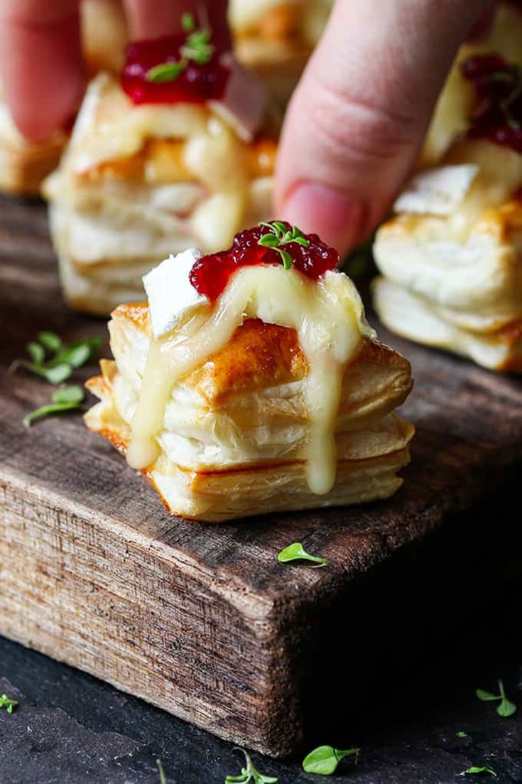 Mouth watering Cranberry Brie bites. Perfect for your holiday party!