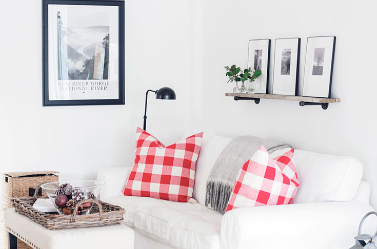 White Sofa with Red Buffalo Check pillows, decked for the holidays. Thanks for sharing.