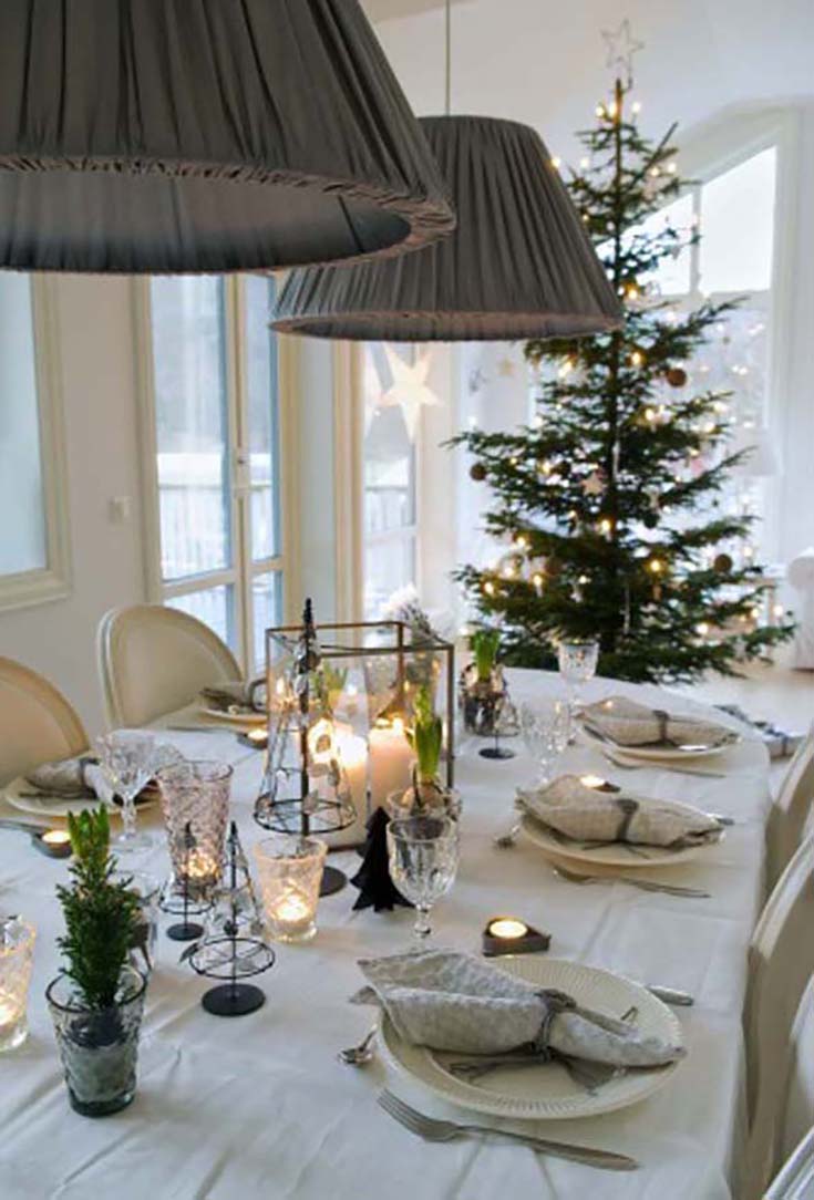 Lots of candles at this Scandinavian Christmas table.