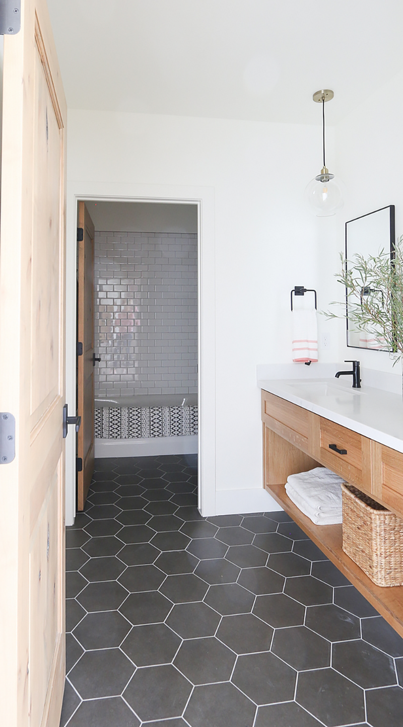 Modern-White-Bathroom-with-Natural-Floating-Vanity-Black-Hexagon-Tile-Design-by-Lindsay-Hill-Interiors