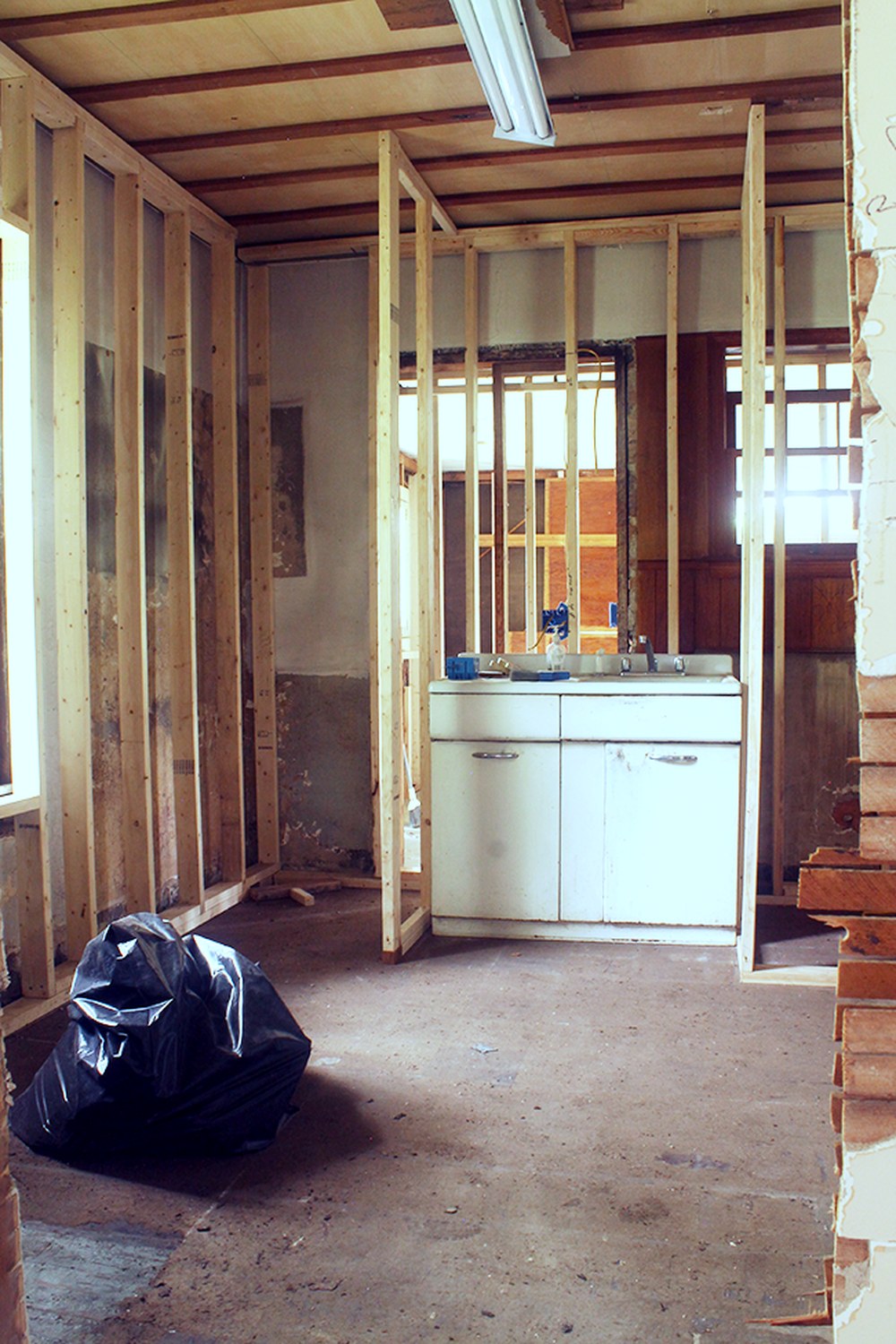 The Downtown Bungalow primary bathroom during framing, when it was still the old kitchen