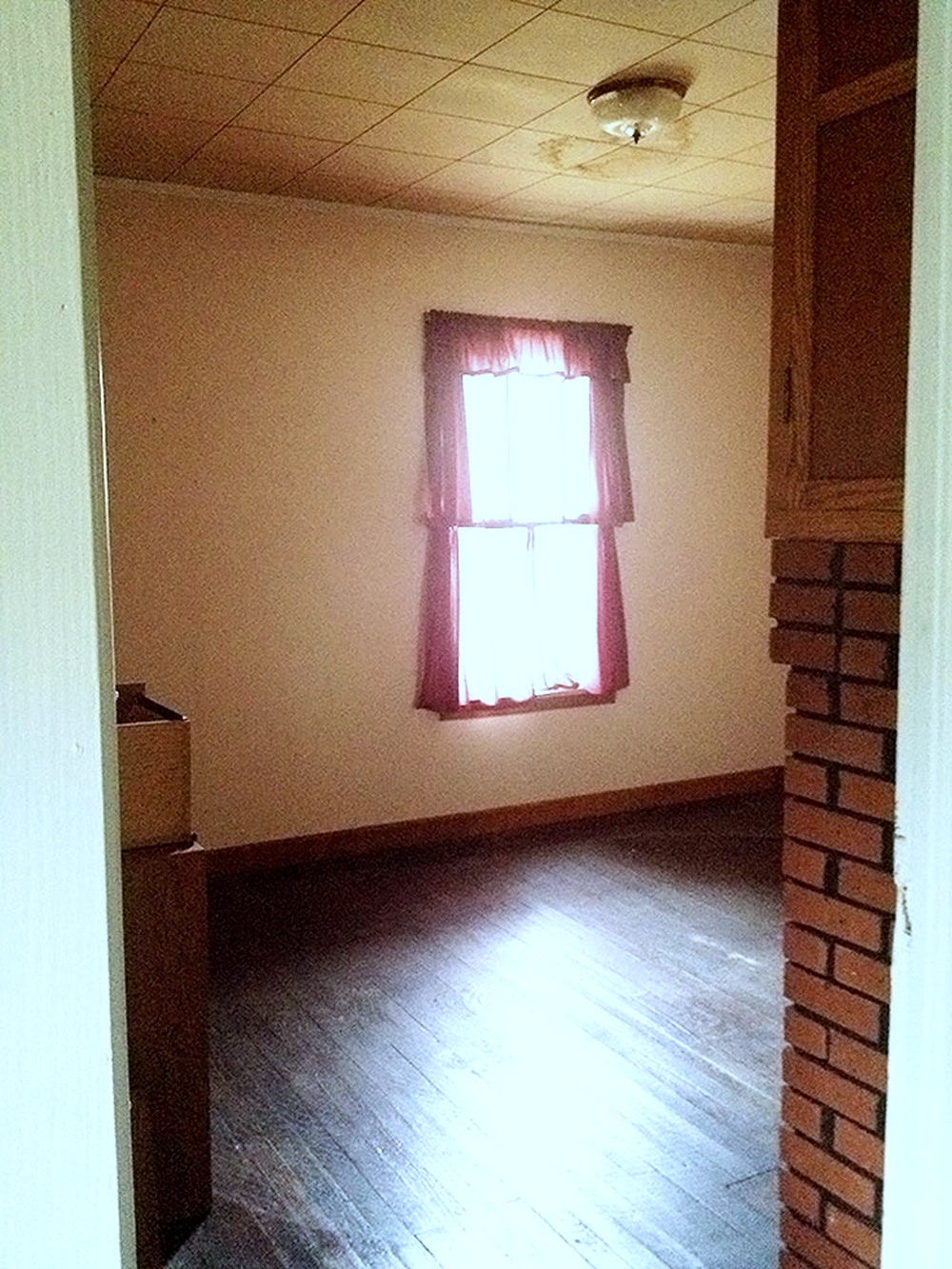 Downtown Bungalow primary bedroom before the renovation, 2014