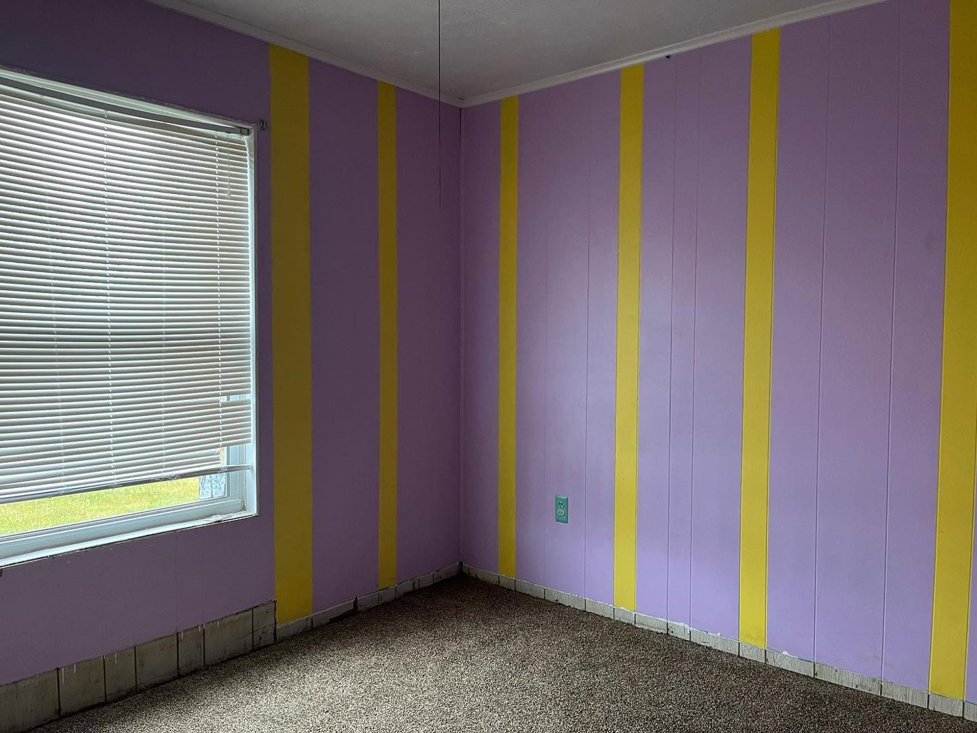 Woodbridge bedroom before with purple and yellow stripes